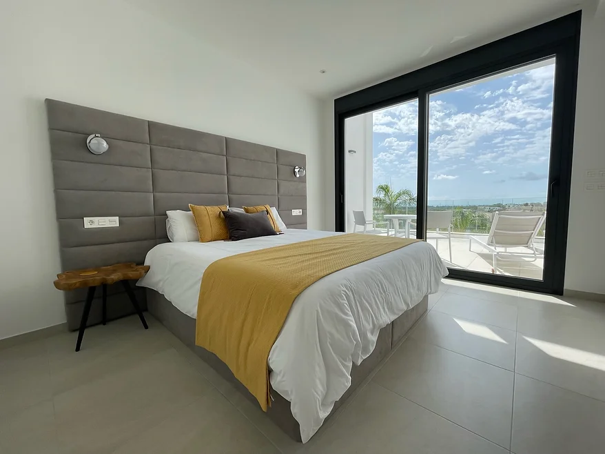 Citrine bedroom with yellow accents and sea view